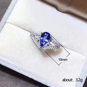 Pear cut blue gemstone V-shape ring with white crystals, 10mm width and 3.2g weight