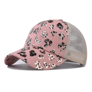 Close-up of pink leopard print baseball cap with breathable mesh and silver metallic pattern