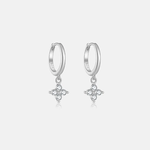 Macro shot of S925 sterling silver hoop earring with sparkling zircon flower pendant