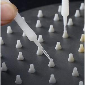 Mini shower head cleaning brush with white plastic handle for bathroom nozzle descaling