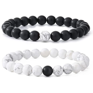Detail of 8mm matte black obsidian and white marble stone distance bracelets for couples