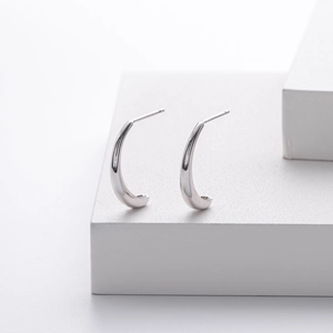 Close-up of S925 sterling silver petal stud earrings with 925 authenticity hallmark