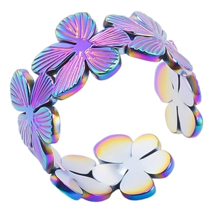 Detail of floral-shaped stainless steel ring with vibrant rainbow gradient finish