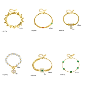 Collection of six gold titanium steel bracelets featuring pearls and green crystals