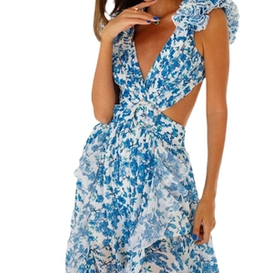 Floral maxi dress with V-neck, ruffles, and waist cut-outs in blue and white print