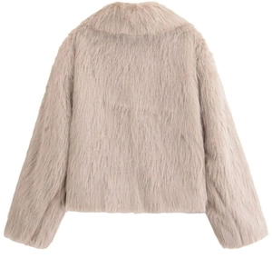 Close-up of fluffy faux fur texture on a warm beige short jacket for women