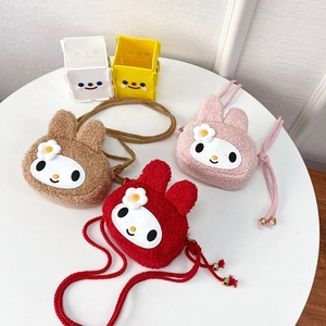 Three cute plush rabbit crossbody bags in brown, pink and red colors on a white table