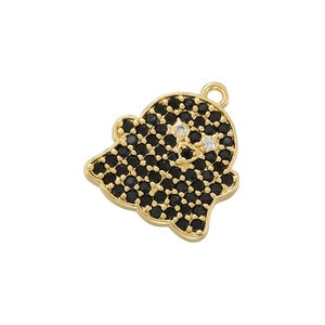 Detailed view of a gold ghost charm with black zircons and heart-shaped cutout