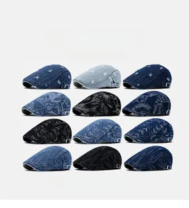 Detail showing 12 denim newsboy cap styles with adjustable side buckles and textures