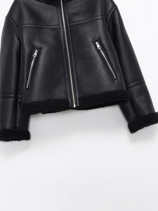 Detail of black faux leather jacket with fleece lining and silver zipper closure