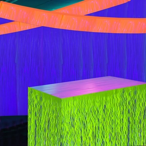 Neon party table decoration with fluorescent green ripples and blue backdrop scenery