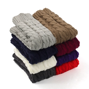 Thick cable knit leg warmers for winter in eight different colors on white background
