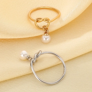 Minimalist gold and silver stainless steel rings with knot design and hanging pearl pendants