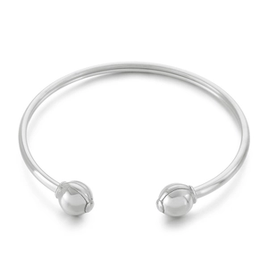 Minimalist silver stainless steel open bangle featuring round sphere ends on white background
