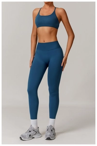 Deep lake blue seamless yoga set featuring thin strap sports bra and high waist leggings