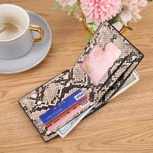 Men's retro snake pattern leather bifold wallet with multiple card slots on wooden desk
