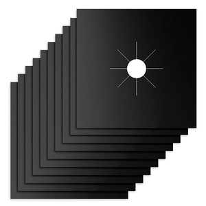 Close-up of stacked black heat-resistant teflon gas stove liners with center cutouts