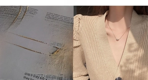 Detail of gold heart pendant necklace on minimalist chain with model lifestyle shot