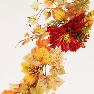 Autumn maple leaf garland with red flowers, berries and pumpkin for festive wall decoration