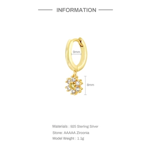 Detail of 925 sterling silver flower hoop earrings with yellow zircon and 9mm inner diameter
