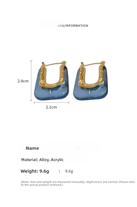 Macro view of blue acrylic bag-shaped earrings with gold alloy hooks and product dimensions