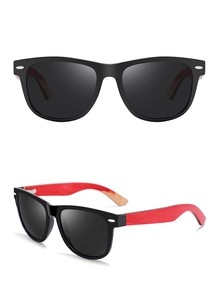Detail of classic oval sunglasses featuring dual-tone wood temples and black frames