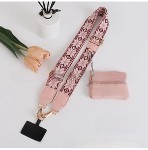 Detail of pink ethnic woven crossbody phone strap with a matching coin purse attachment