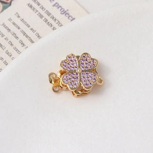 Macro shot of purple cubic zirconia rotating clover magnetic clasp for jewelry DIY