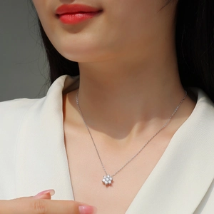 Elegant 925 silver snowflake necklace with Moissanite stones on female model neckline