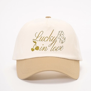 Lucky in Love embroidered cotton baseball cap in beige and khaki color block style
