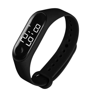 Detail view of black LED digital sports watch with silicone strap on white background