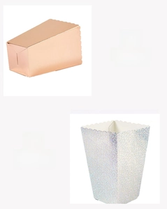 Detail of rose gold and laser silver party boxes with scalloped edges and sturdy paper