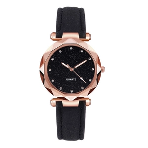 Macro detail of starry dial with rhinestone markers and rose gold geometric watch case
