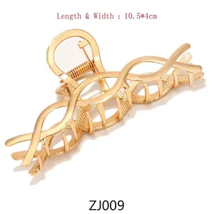Detail of large gold metal butterfly hair claw clip showing 10.5x4cm size and spring