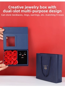 Navy blue jewelry gift box with nine red roses and velvet slots for rings and necklaces