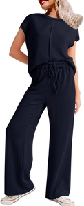 Detailed view of dark blue ribbed knit fabric and drawstring waistband on lounge pants