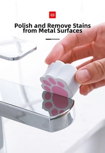 Macro detail of cat paw abrasive sponge cleaning stubborn stains on a metal faucet