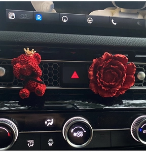 Red bear with crown and peony flower diffuser clips on car air vent dashboard