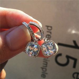 Sparkling cushion-cut cubic zirconia drop earrings with micro-pave stones on silver hooks