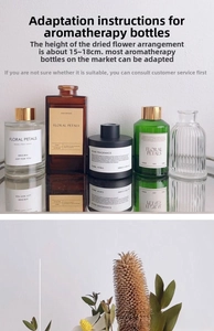 Close-up of dried flowers and various glass aromatherapy bottles for home decor