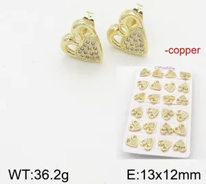Detailed macro view of 18k gold plated copper heart earrings set with sparkling stones