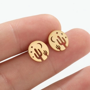 Gold hollow round earrings featuring cactus, moon and star designs shown on fingers