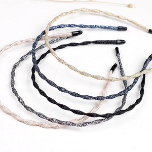 Set of 6 slim twisted metal headbands in gold, silver, and black glitter fabric