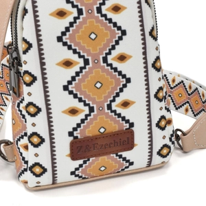 Detail view of ethnic canvas crossbody bag with geometric diamond patterns and leather trim
