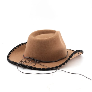 Detail of western cowboy hat with whipstitched brim and decorative brown cord tie