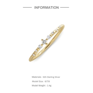 Detailed view of gold plated S925 silver ring with sparkling white cubic zirconia stones