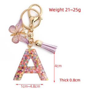 Pink glitter resin letter A keychain with purple butterfly and tassel charm
