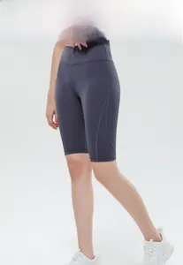 Detail of high-waisted charcoal yoga shorts showing ergonomic stitching and slim fit