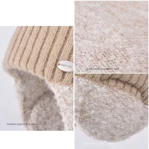Winter knitted ear protection hat with warm faux lamb wool lining and plush design