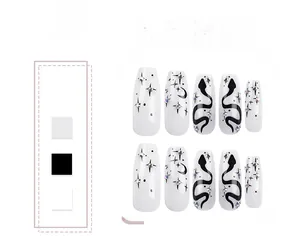 Detail of long coffin press-on nails featuring white base, black snake, and rhinestones